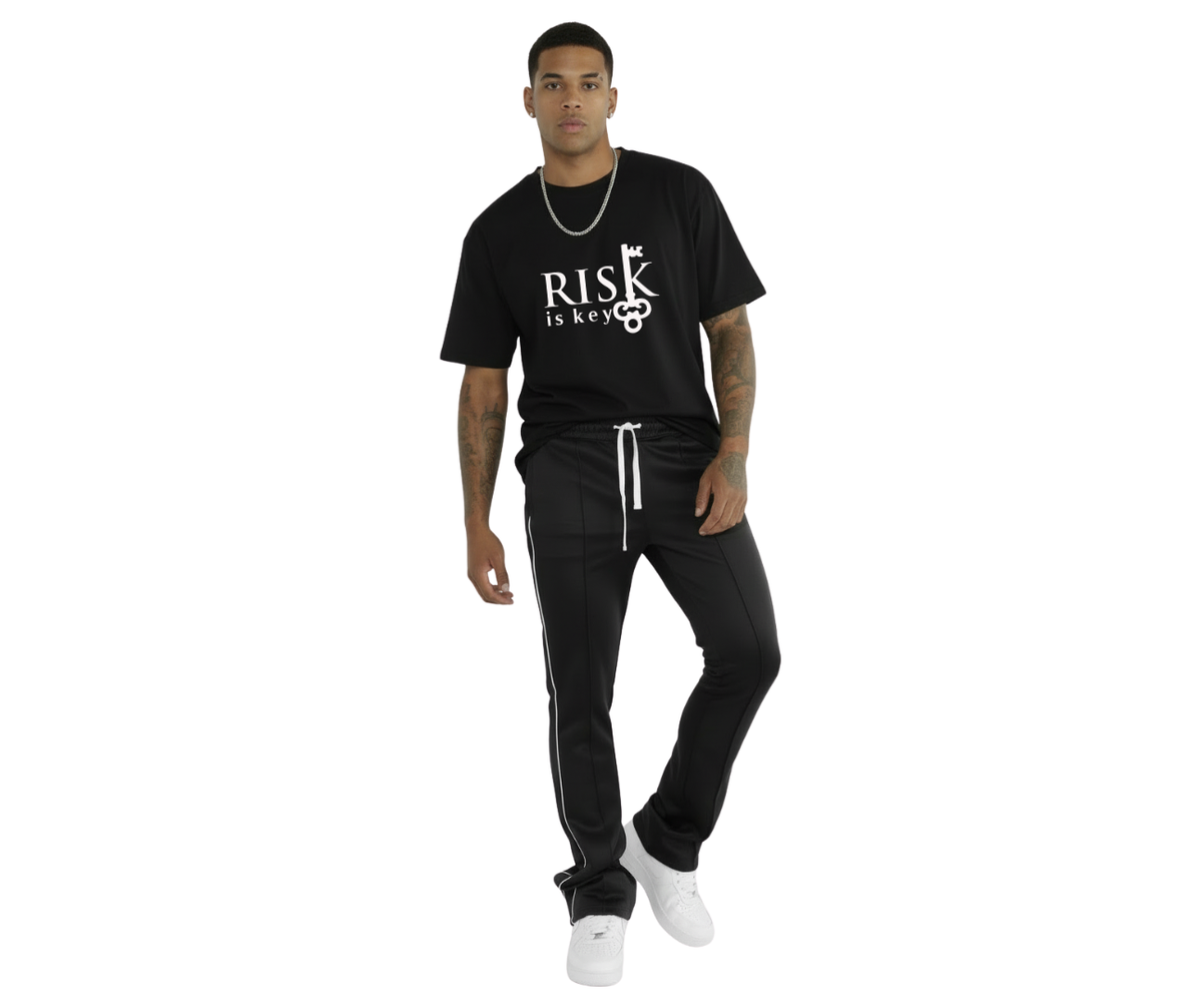 Unisex Risk-Taker Stacks stacked joggers in black with adjustable drawstring and modern streetwear design styled with Risk is Key black t-shirt