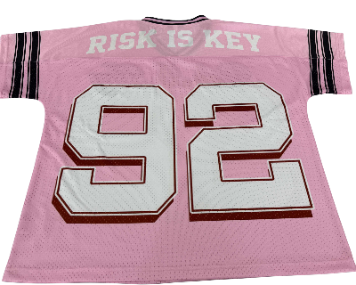 Back view of the RiRi the Beagle pink sports jersey by Risk is Key, showcasing the high-quality stitching and flattering feminine silhouette.