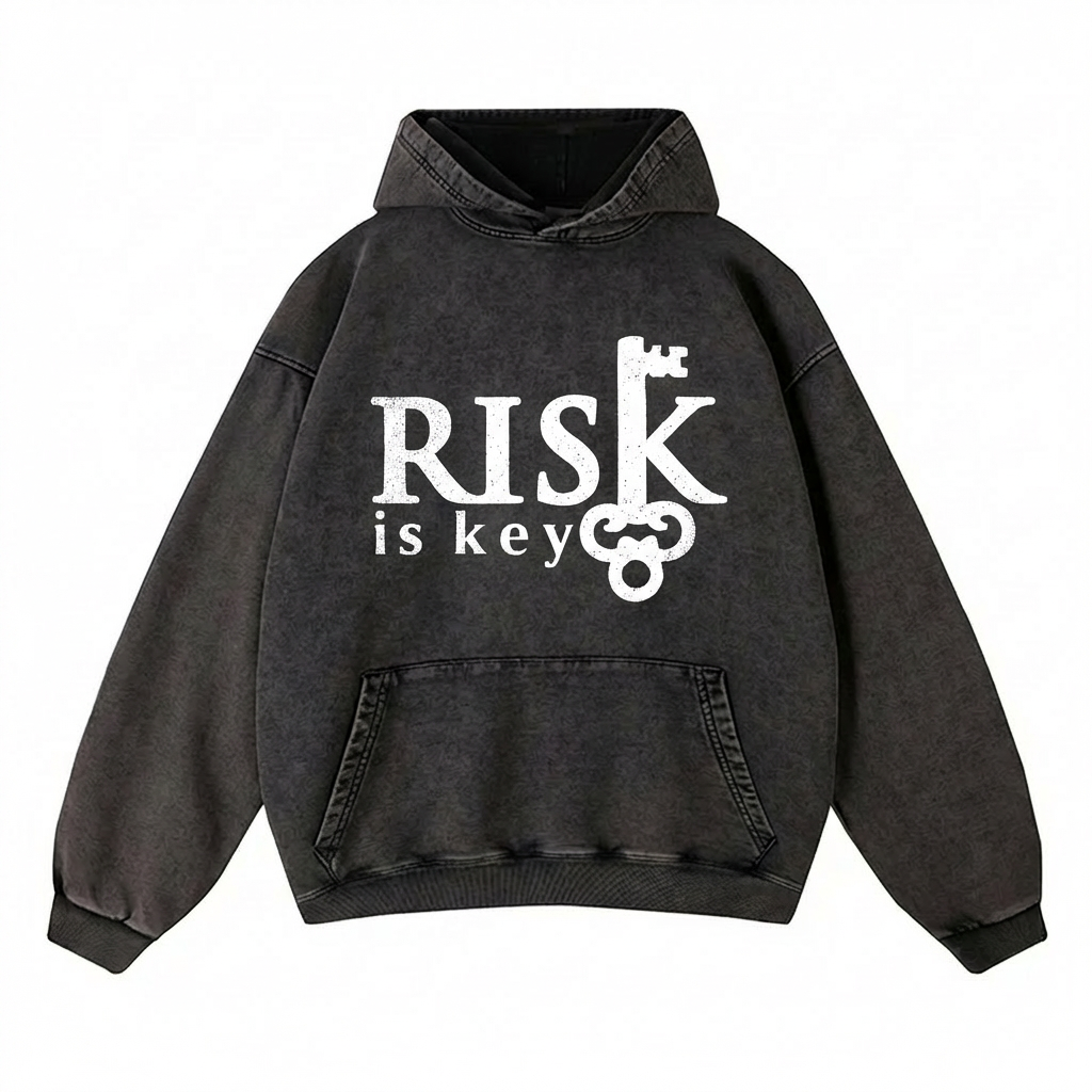 Flat lay of the Signature Risk Vintage Wash Pullover in black, detailing the distressed texture and high-quality construction of the hood and cuffs.