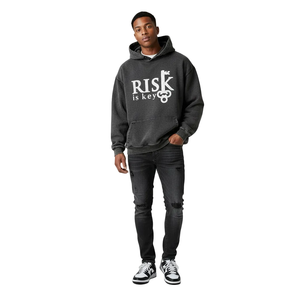 Gen Z male wearing the Signature Risk Vintage Wash Pullover in black styled with denim jeans, showcasing a relaxed streetwear fit and faded aesthetic.