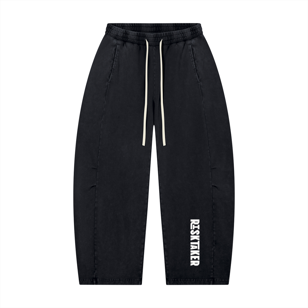 Black barrel jogger pants with Risk is Key logo on a white background