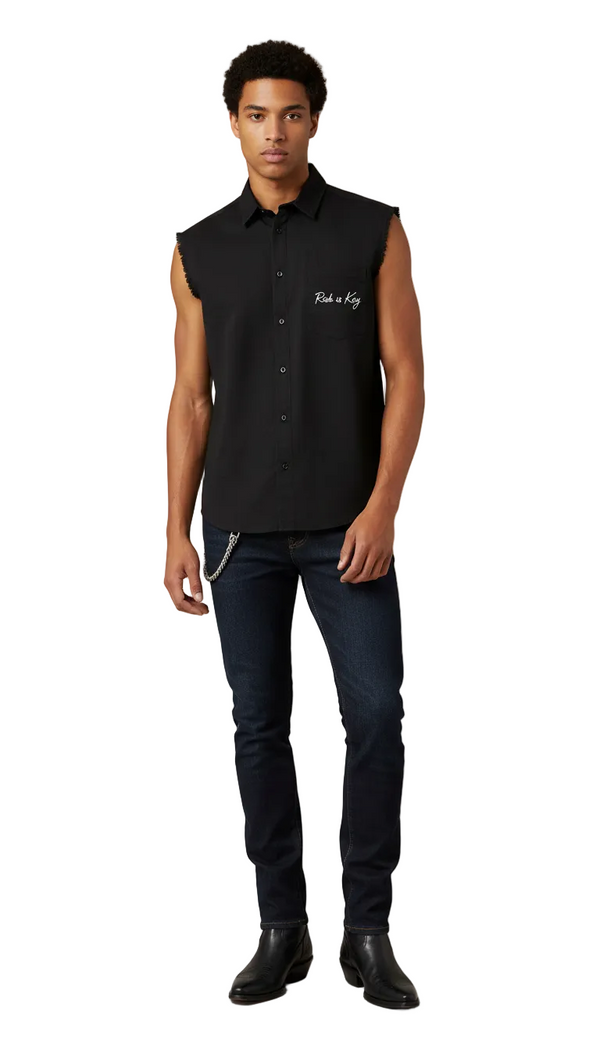 A young man wearing the Maverick black denim sleeveless top with frayed armholes and 