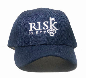 Navy blue cotton dad hat for men featuring the Risk is Key embroidered logo, low-profile unstructured crown, and curved brim.