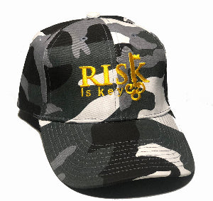 Black and white camo dad hat with Risk is Key branding, streetwear style baseball cap.
